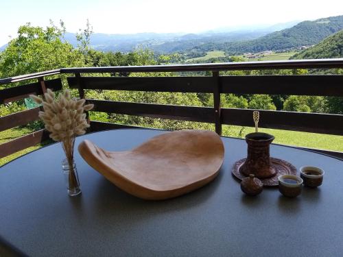 a table with a wooden chair on top of a table at Getaway "At the three lights" in Sevnica