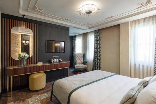 a hotel room with a bed and a desk at Tria Hotel Istanbul-Special Category in Istanbul