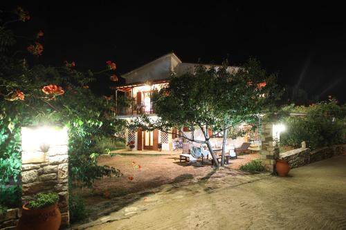 a house at night with lights in front of it at Koromilia Villa in Neo Klima