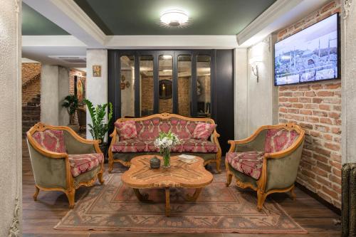 a living room with two couches and a table at Tria Hotel Istanbul-Special Category in Istanbul