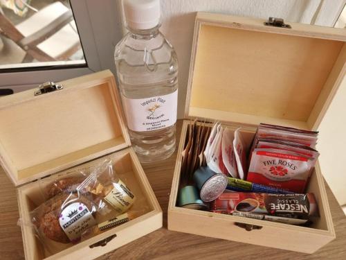 a bottle of water sitting next to two wooden boxes at Impunzi Place in Kloof