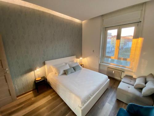 Кровать или кровати в номере Suite boutique Moscova