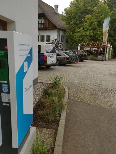 a gas pump on the side of a building at Landhotel Agathawirt in Bad Goisern