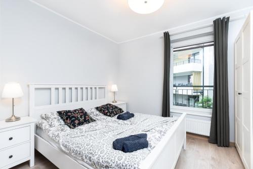 En eller flere senge i et værelse på Apartament Mio Mare