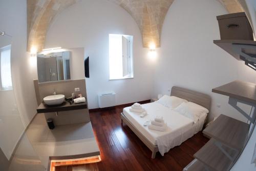 Postel nebo postele na pokoji v ubytování Tulliani Residenze Matera
