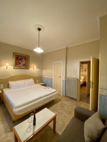 מיטה או מיטות בחדר ב-Arma Faliro Apartments