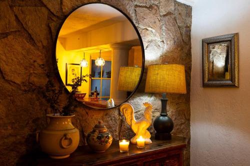 a room with a mirror and a table with candles at Casa Aurora, estilo rústico-moderno, Guanajuato in Guanajuato
