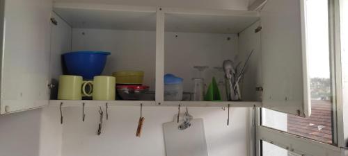 a white cabinet with some utensils on it at FARO FINO 106 ORLANDO in Goiânia