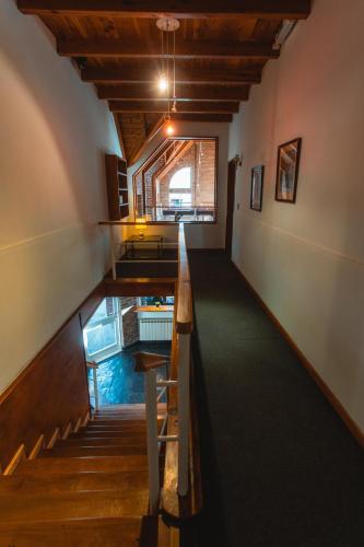 a view of a hallway with an aquarium in a room at Hosteria Las Walkirias in San Martín de los Andes