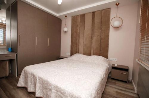 Кровать или кровати в номере 2 bedroom apartment on Shulginih