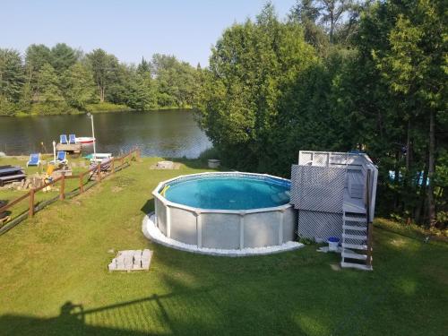 Lakefront Cottage with Swimming Pool and Billiards