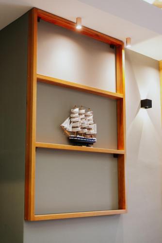 a shelf with a toy boat on it at AM Palace in Ulcinj