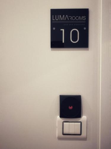 a clock on a wall with a clock on it at Lumarooms B&B in Reggio Calabria