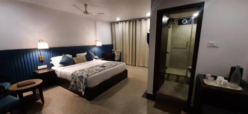 Una cama o camas en una habitación de Hotel TSG Grand