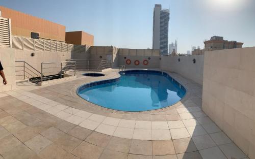 a swimming pool on the roof of a building at FEMALE ONLY-AnaRuby Backpackers- Metro Station Mashreq in Dubai