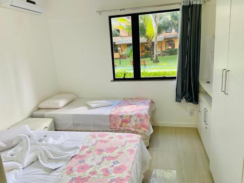 Katil atau katil-katil dalam bilik di Descanso com pé na areia!