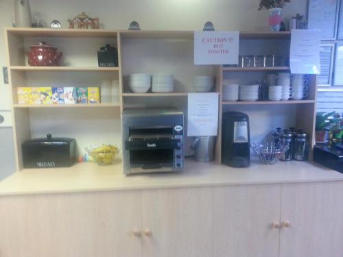 a kitchen with a counter with a coffee maker on it at The Penrhyn in Blackpool