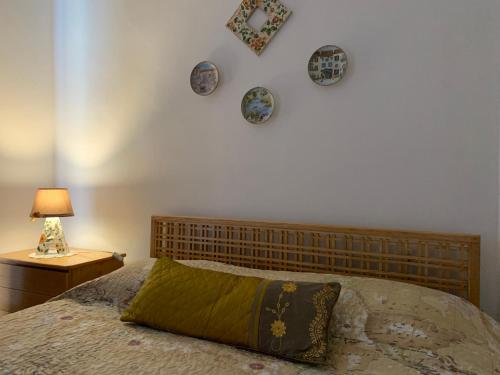 "L'Armonia" Apartment tesisinde bir odada yatak veya yataklar