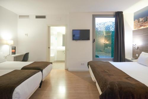 מיטה או מיטות בחדר ב-Hotel BESTPRICE Diagonal