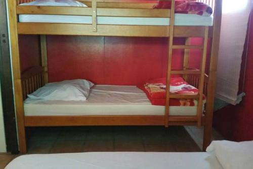 a bunk bed with two bunk beds in a room at Ti' Kaz Kréol in Salazie