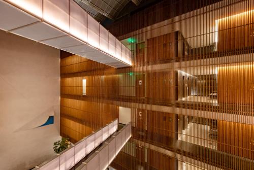 a hallway of a building with wooden walls at Radisson Resort and Spa Lonavala in Lonavala