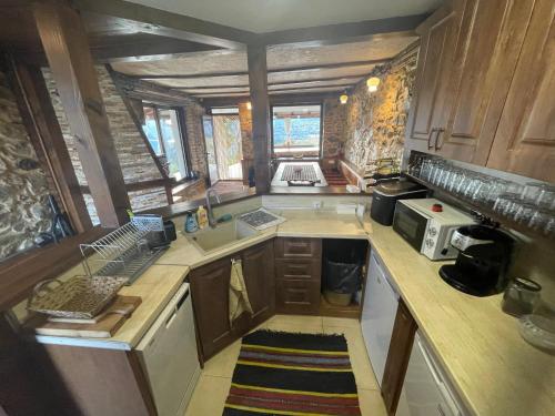 an overhead view of a kitchen with wooden cabinets at Вила Габер in Zlatograd