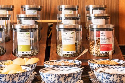 a group of jars of food on a table at Superior Hotel Tirolerhof - Zell am See in Zell am See