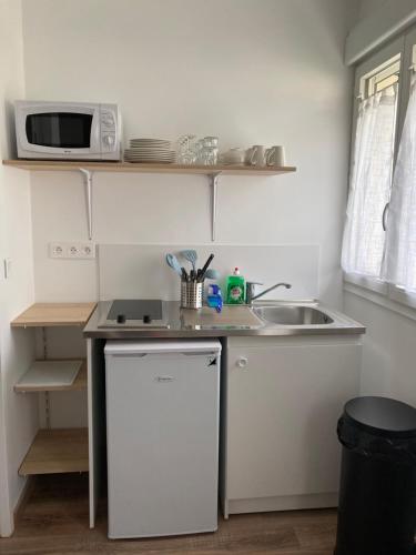 Η κουζίνα ή μικρή κουζίνα στο Appart’hôtel saint patrice