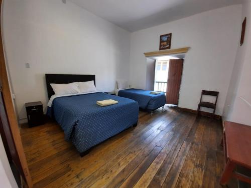 
Ein Bett oder Betten in einem Zimmer der Unterkunft Sumayaq Hostel Cusco
