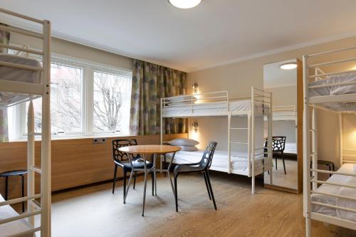 Säng eller sängar i ett rum på Göteborgs Mini-Hotel