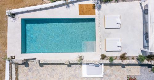 an overhead view of a swimming pool on a house at Molos Beachfront Villa in Molos Parou