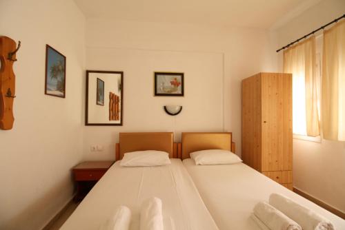 Postel nebo postele na pokoji v ubytování SARTI CENTER studios