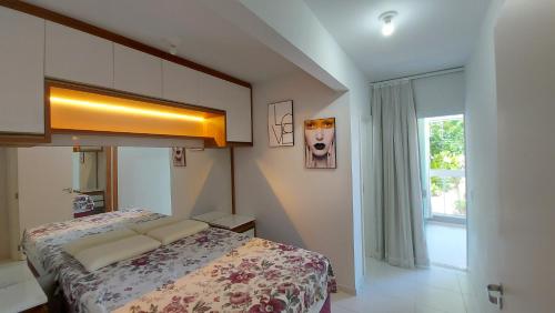 Postel nebo postele na pokoji v ubytování RESIDENCIAL BORBOLETAS DO MAR