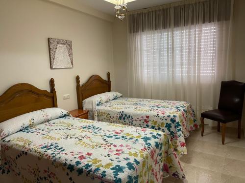 Llit o llits en una habitació de Piso O cruceiro 2