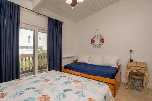 Un pat sau paturi într-o cameră la Tiki 216