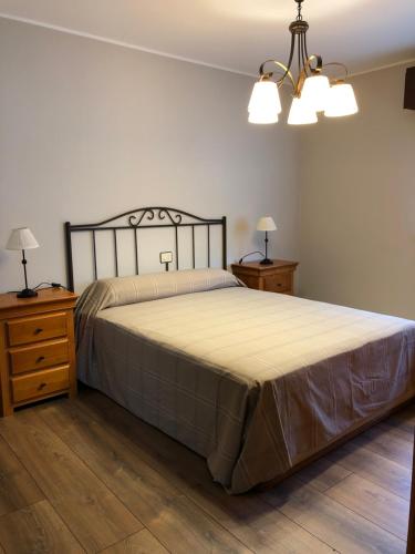 En eller flere senge i et værelse på Vivienda vacacional De La Prida