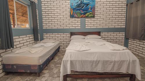 Ein Bett oder Betten in einem Zimmer der Unterkunft The Barrel Hostel