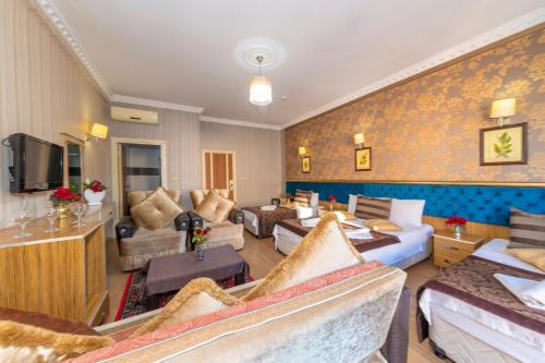 a hotel room with couches and a living room at Ista Palace Hotel in Istanbul