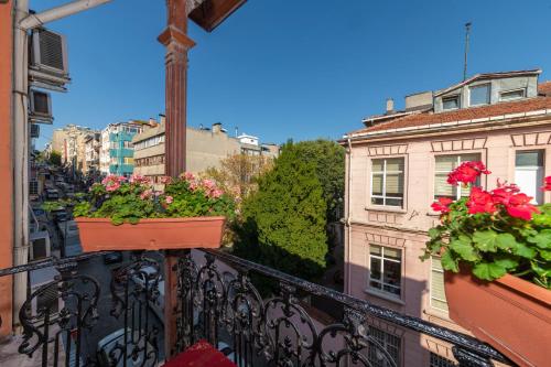 a balcony with flower boxes on a city street at Ista Palace Hotel in Istanbul