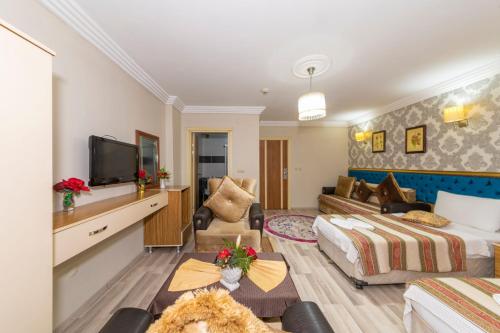 a hotel room with a bed and a tv at Ista Palace Hotel in Istanbul