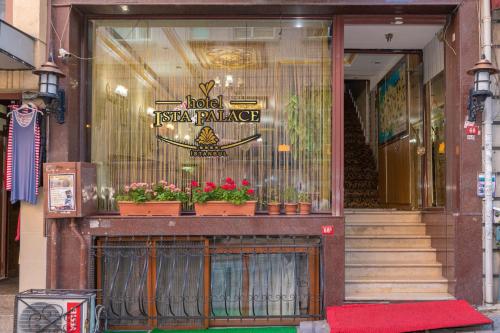 a store front with potted plants in the window at Ista Palace Hotel in Istanbul