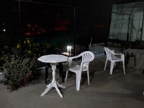 two chairs and a table and a table and chairs at La Casona de Susana in Colón