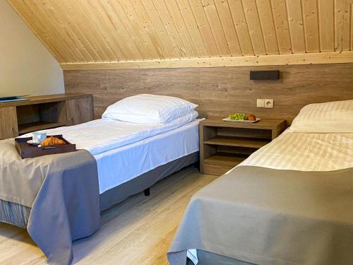 Postel nebo postele na pokoji v ubytování Ośrodek Agroturystyczny Zacisze