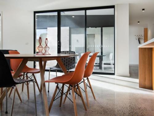 a dining room with a table and chairs at Arenas North - 2 bedroom dog friendly home in Daylesford