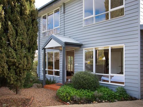 a house with an awning on the front of it at Accolade -3 bedroom, close to Lake Daylesford in Daylesford