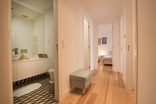 a bathroom with a toilet and a sink at Alfama Premium by Homing in Lisbon