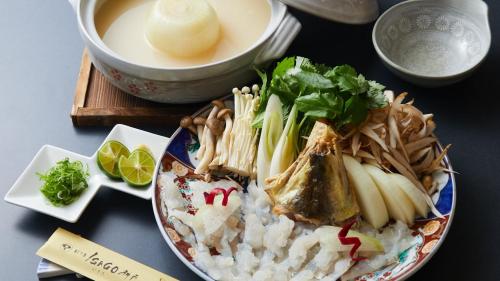 a plate of food with rice and a bowl of soup at Hotel Isago Kobe in Kobe