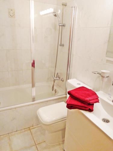 a bathroom with a toilet and a shower and a sink at Charming House with Boho terrace in Chayofa