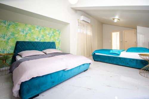 Una cama o camas en una habitación de Villa M&M
