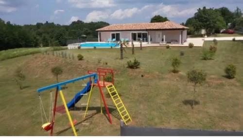 a large yard with a playground with a slide at Villa Heaven Green in Pazin